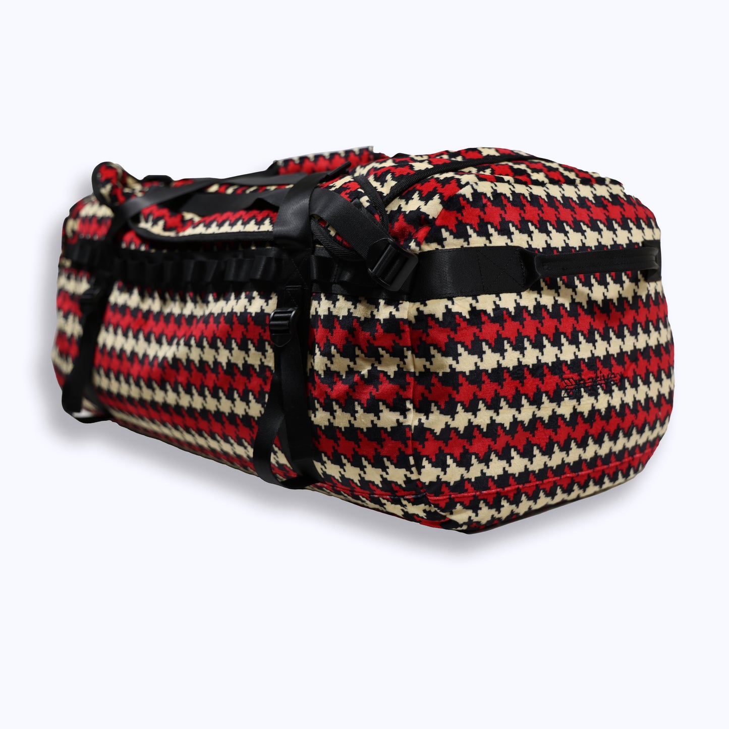 houndstooth velour duffel bag backpack in cream/crimson (black)